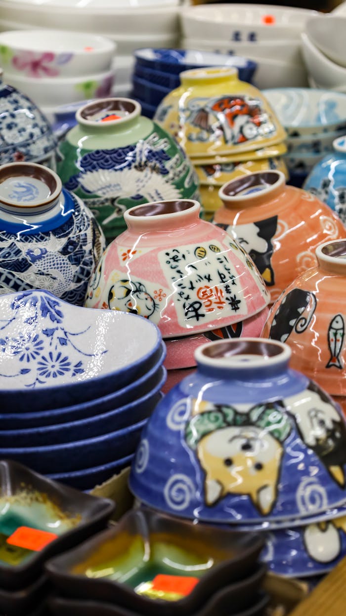 A vibrant collection of Japanese ceramic bowls showcasing intricate designs and colors.